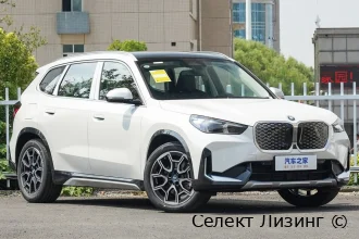 Профиль удлиненного кузова электромобиля BMW iX1 вид сбоку BMW iX1 вид сбоку